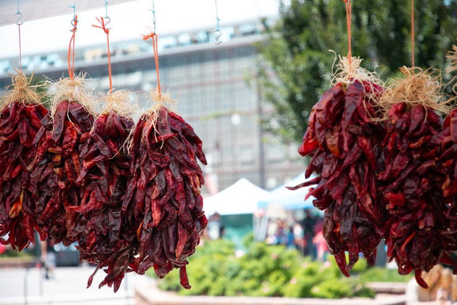 Five ristras hang at an outdoor Rail Yards booth.
