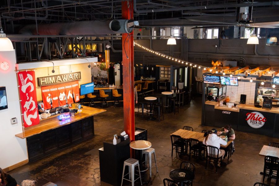 An above shot shows a large seating area with different vendors' stalls.