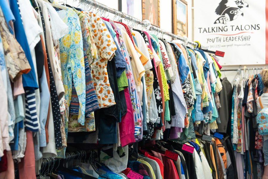 Colorful clothing fills the rack at Talking Talons Thrift Store.